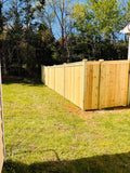 Pressure treated pine wood privacy fence.