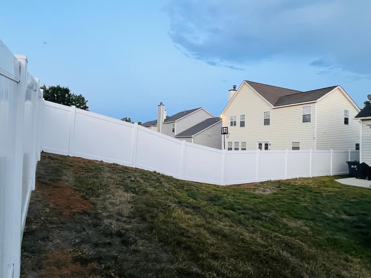 White Vinyl Privacy Fence for a private neighborhoods.
